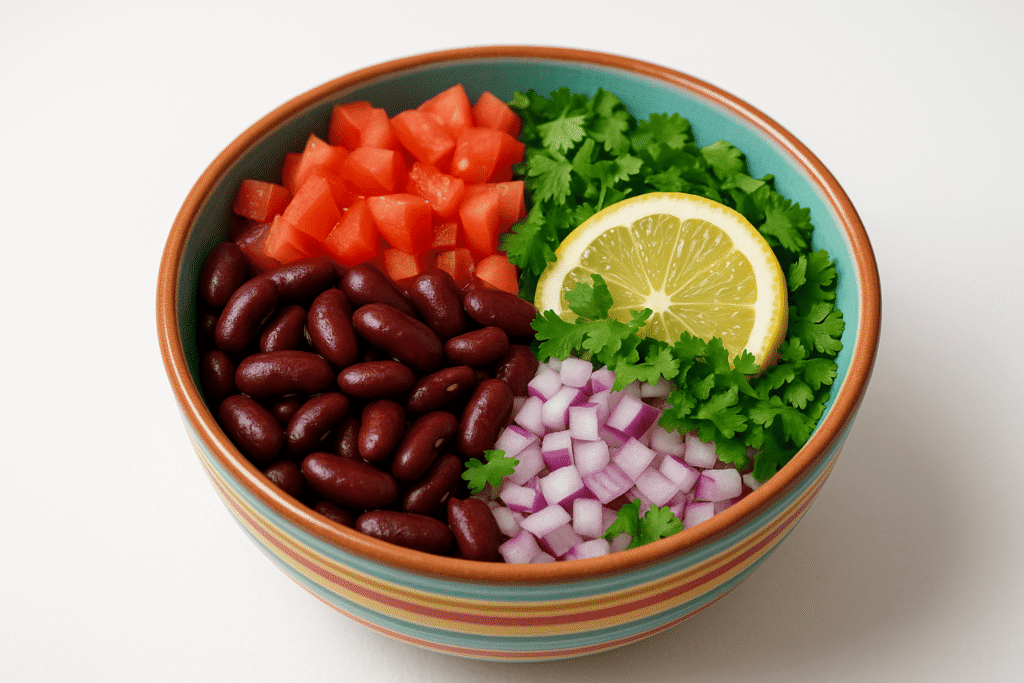 a bowl of food with a lemon slice and beans